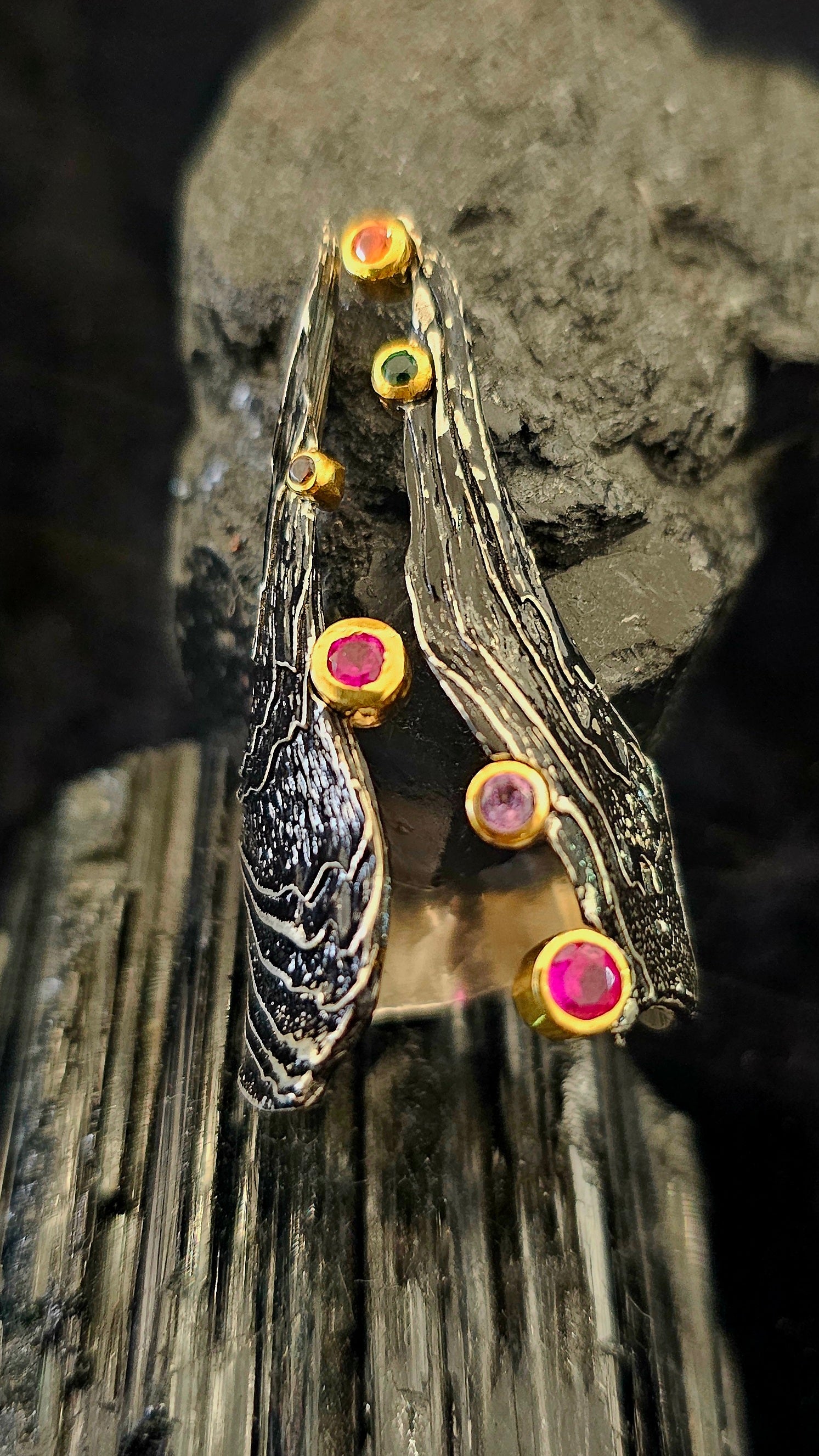 “Celestial Embers” Ring
Like scattered stars across the cosmos, this ring carries the embers of otherworldly fire. Each stone glows with an inner light, whispering stories of alchemy and elemental forces. Bold and enchanting.